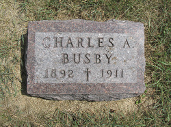 Charles A “Chas” Busby 