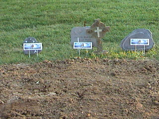 FILE - In this Nov. 28, 2011 file photo, the headstone of Sheri Coleman,  and her sons, Garett, and Gavin, are seen at Evergreen Cemetery in Chester,  Ill. On Tuesday, Oct. 16