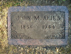 John M Aeils 