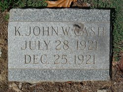 K.  John W. Cash 