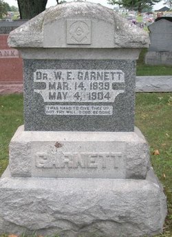 Dr William E Garnett 