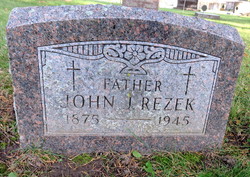 John J Rezek 